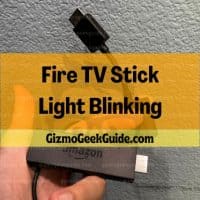 Hand holding an Amazon Fire TV Stick