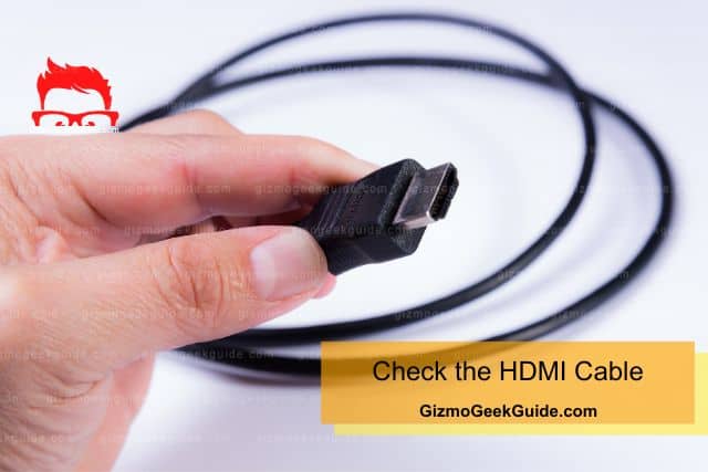Hand holding HDMI cable